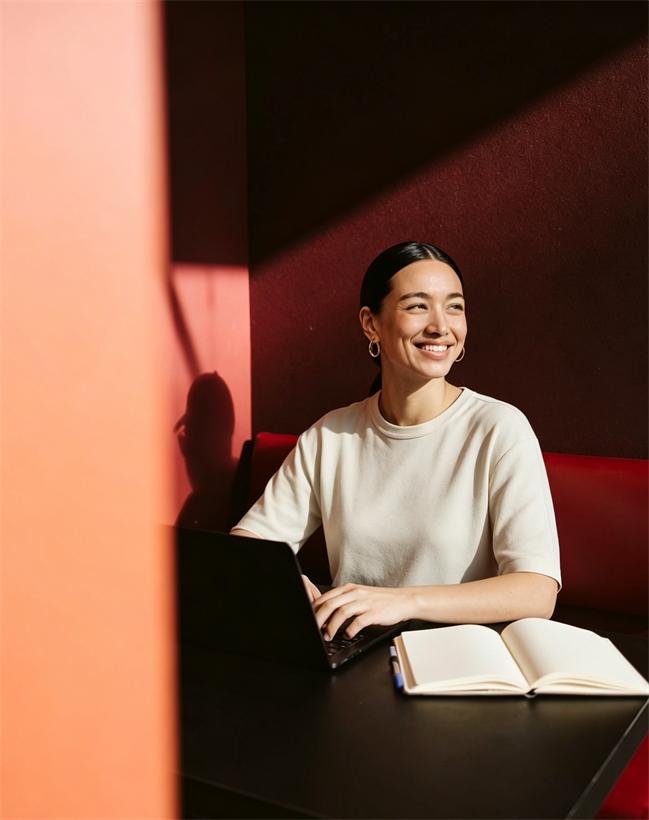 Someone at a desk in warm light