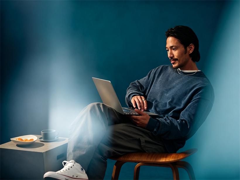 Someone working on a laptop